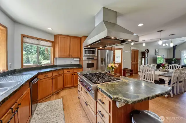 Kitchen facing towards entryway.