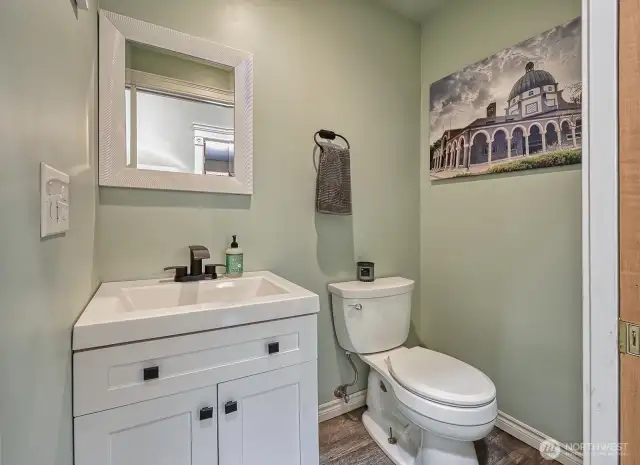 Updated powder room off the hallway.
