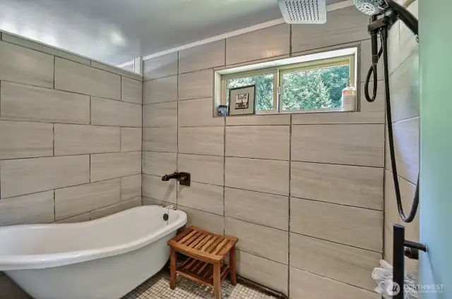 Shower and bath in en-suite bathroom.