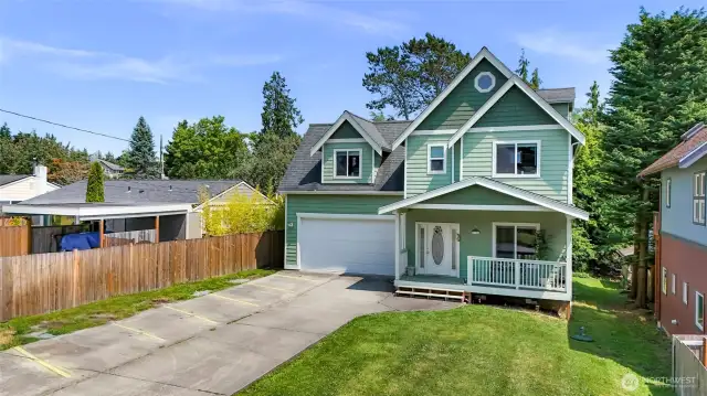 A large flat front yard. Plenty of parking in the driveway, garage, and extra street parking for guests.
