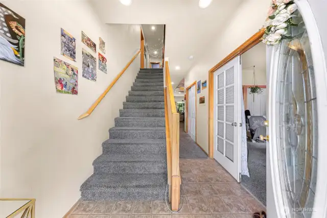 As you enter the home, the first of five bedrooms is located on the mainfloor to the right. There is a hall closet and a bathroom down the hall.