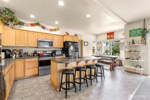 A generously-sized open kitchen with seating for everyone.