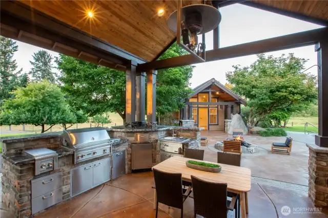 And to your Outdoor Kitchen under this great covered back patio! All Stainless Steel Lynx Appliances! Also the Guest/Pool House across the Patio