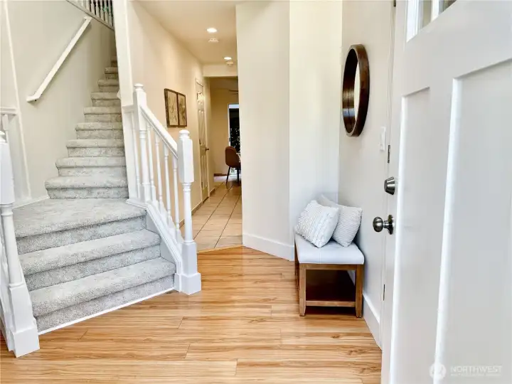 Welcoming entry foyer with new carpet on the  staircase leading to the upper level.