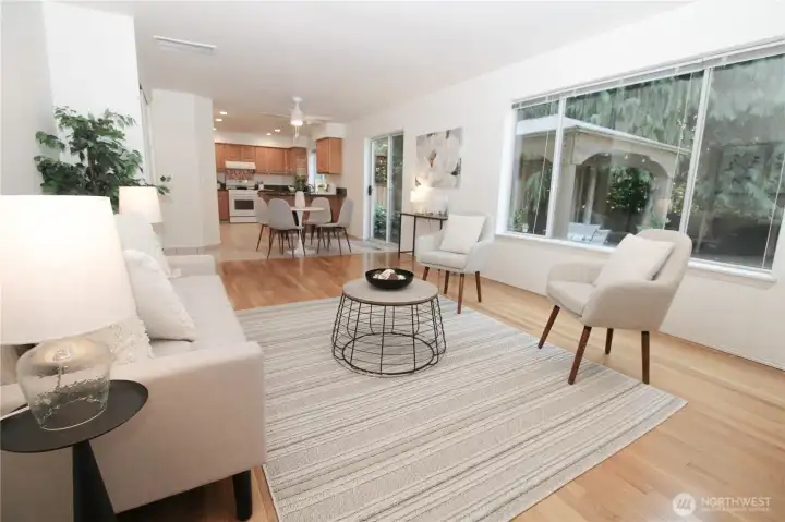 The main living space showcases the home's excellent flow with sight lines to the kitchen and eating nook.