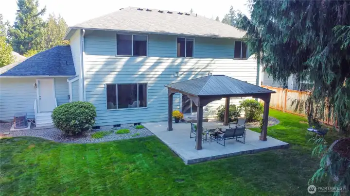 Exceptional outdoor entertaining space featuring a substantial covered gazebo, easy to maintain landscaping, and the rare privacy of backing directly to pristine wetlands, a setting you simply can't recreate.