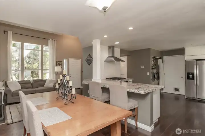 Kitchen flows effortlessly into dining and living areas.