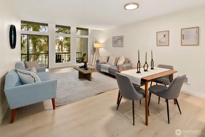 Dining area and living room enjoy a view of the lake.