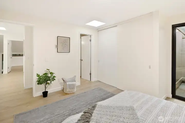 Bedroom #1 on upper level, with extra-large closet and jack-and-jill bathroom access.  Private patio for morning yoga or growing a mini-garden.