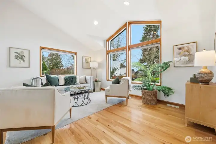 Formal living room with vaulted ceilings