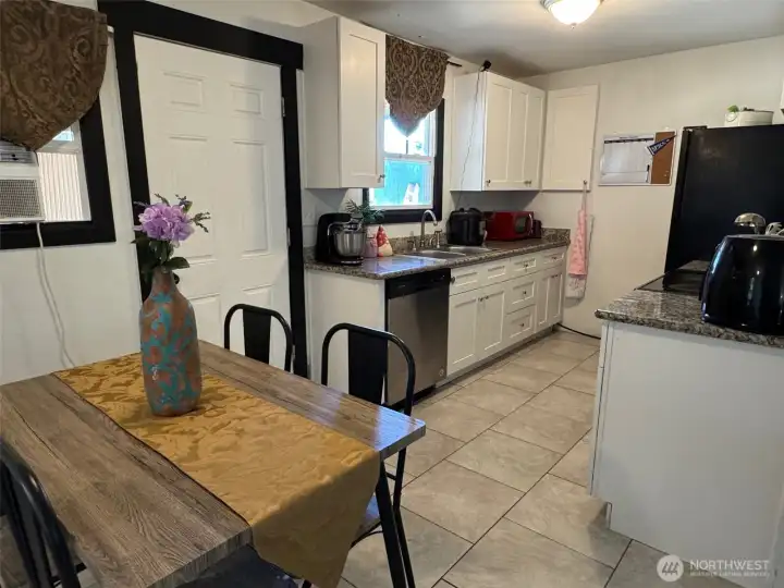 Over view of kitchen, breakfast nook & backdoor to patio