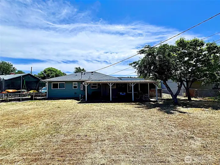 Back view of home with covered patio area