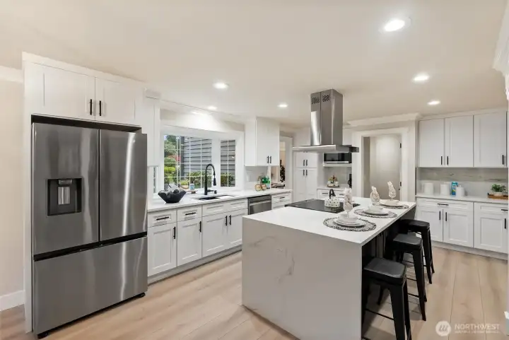 Kitchen featuring quartz countertops, modern fixtures, and generous prep space.
