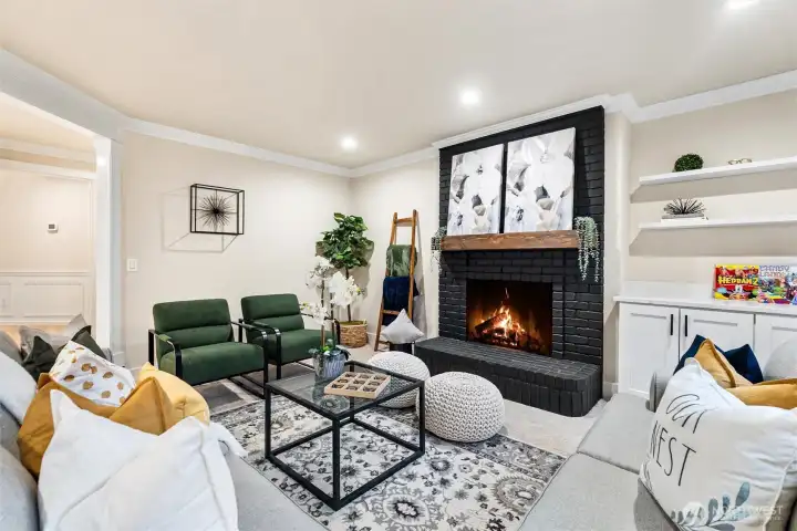 Inviting family room with fireplace and built-in shelving.