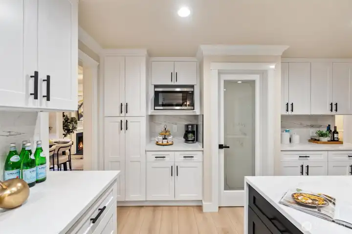 Custom kitchen cabinetry with built-in wall oven and abundant storage.