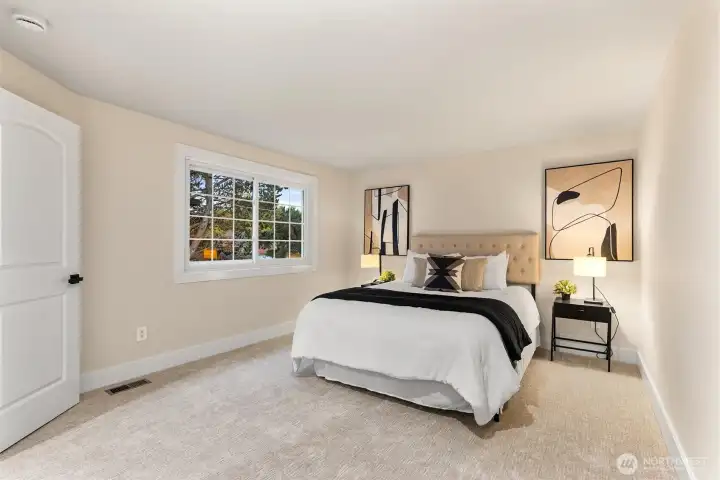 Additional bedroom with bright windows and flexible layout.