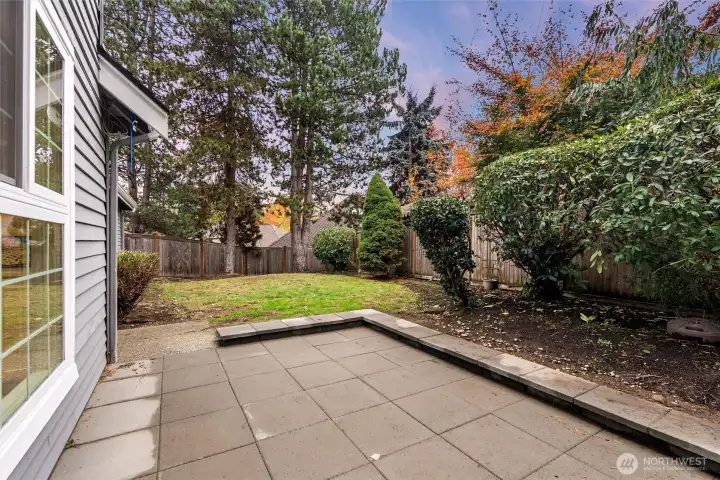 Private backyard patio perfect for outdoor dining and entertaining.