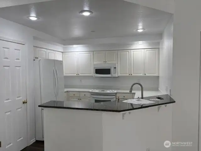 Kitchen with pantry and breakfast island. Kitchen with pantry and breakfast island.