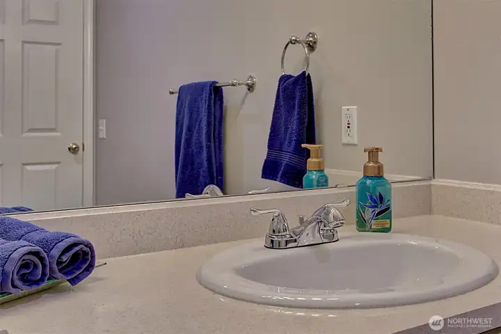 Guest bath with single vanity.