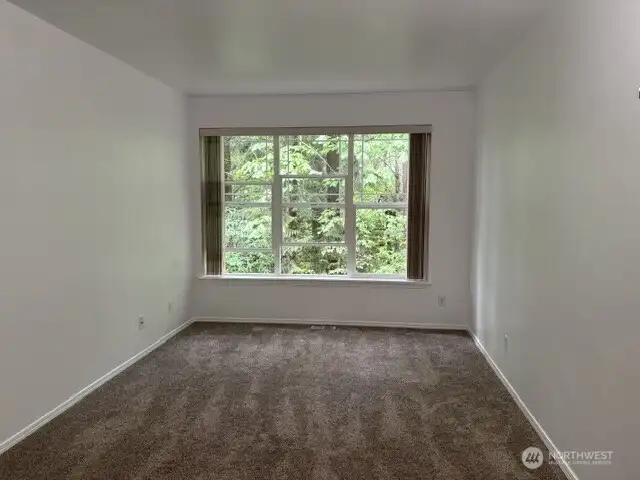 Enjoy the soothing wooded view from the Primary Bedroom. Enjoy the soothing wooded view from the Primary Bedroom.