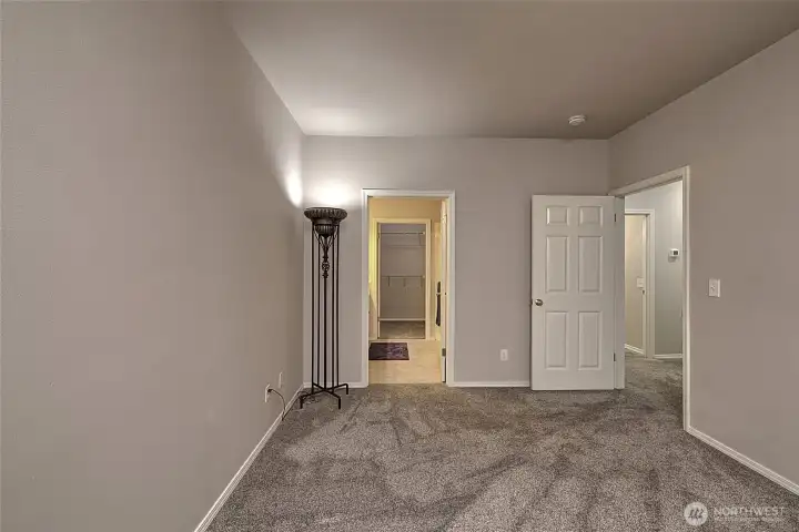 Primary bedroom view of primary bath entrance.