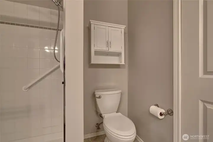 Primary bath with grab bar in shower. Primary bath with grab bar in shower.