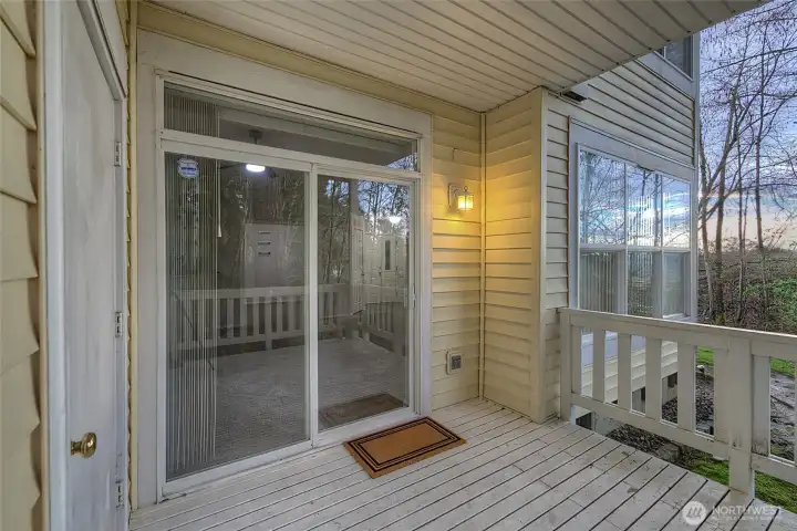 view from stairs showing additional storage closet off the deck.