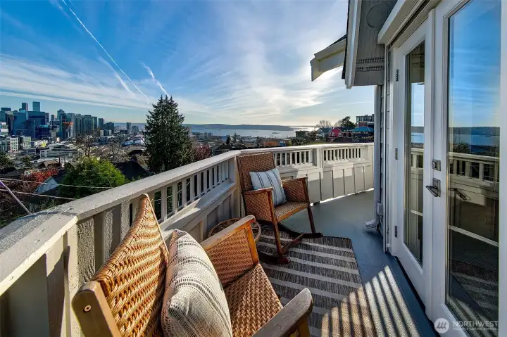 Big views of Downtown Seattle. Great outdoor spaces include decks from living and primary suite, a low maintenance front yard and a ground level sunshine terrace.