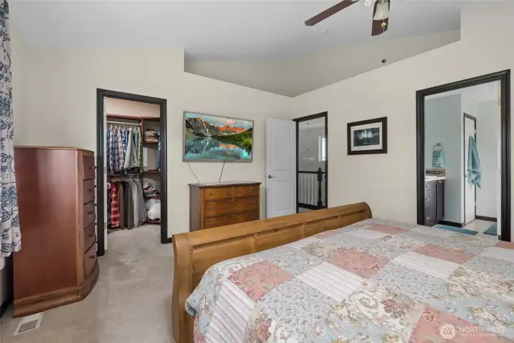 Primary Bedroom Features a Walk In Closet and Ensuite Bathroom.