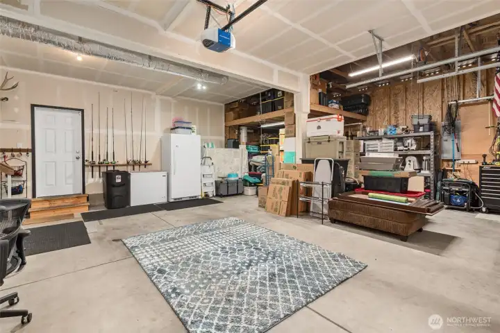 Large, Finished Garage Features a Storage Loft and is Wired For a Whole-House Generator.