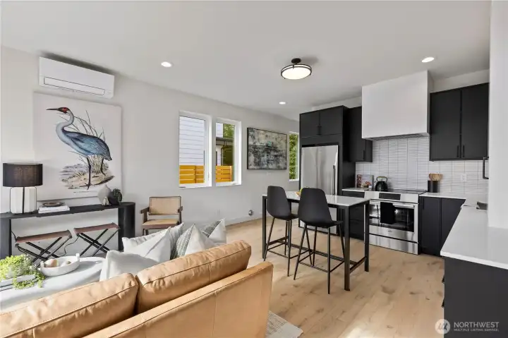 The eat-in kitchen flows seamlessly into the main living area