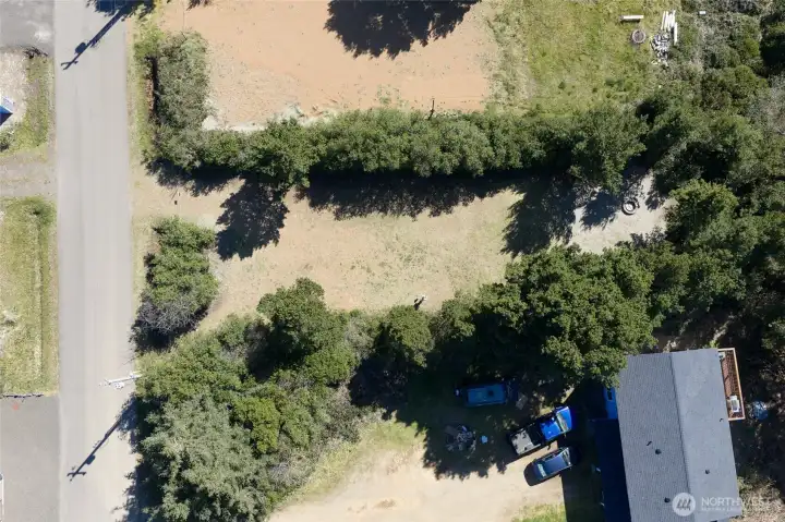 Overhead drone view of the property showing the cleared driveway and beatiful 12,00 sq ft of property!