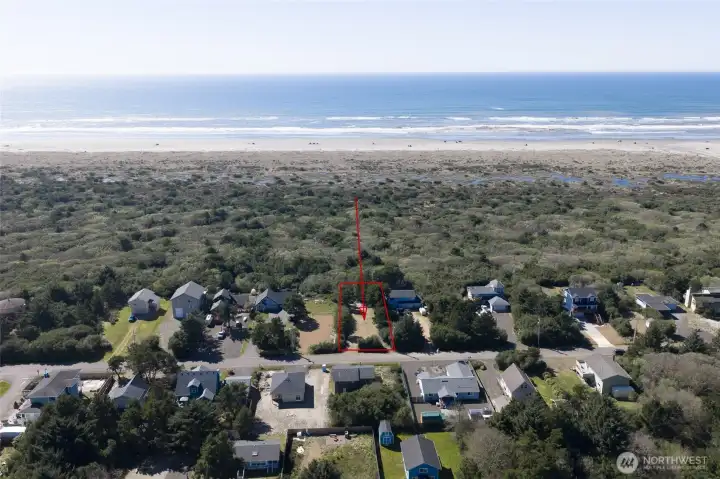 Drone view showing there is only a thin strip of trees and dunes to the ocean!