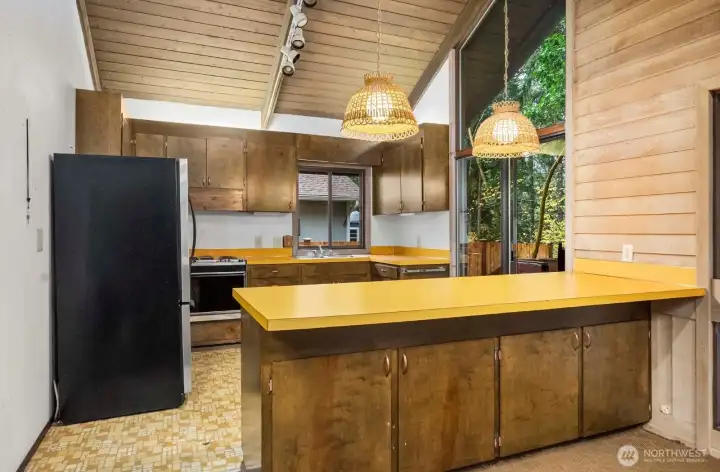 Notice the kitchen layout adjacent to the window.