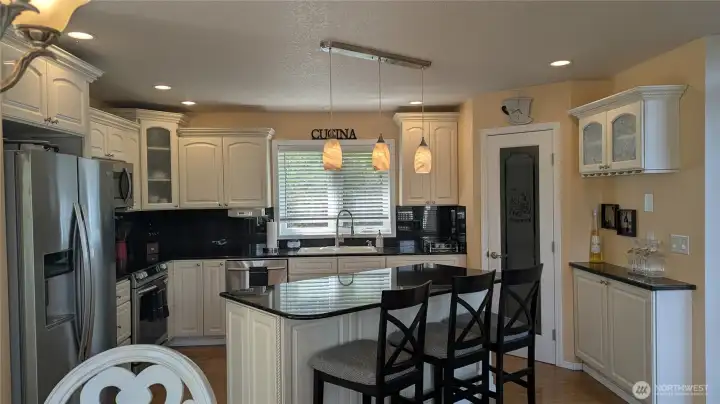 Kitchen area, pantry, doors off to the deck.