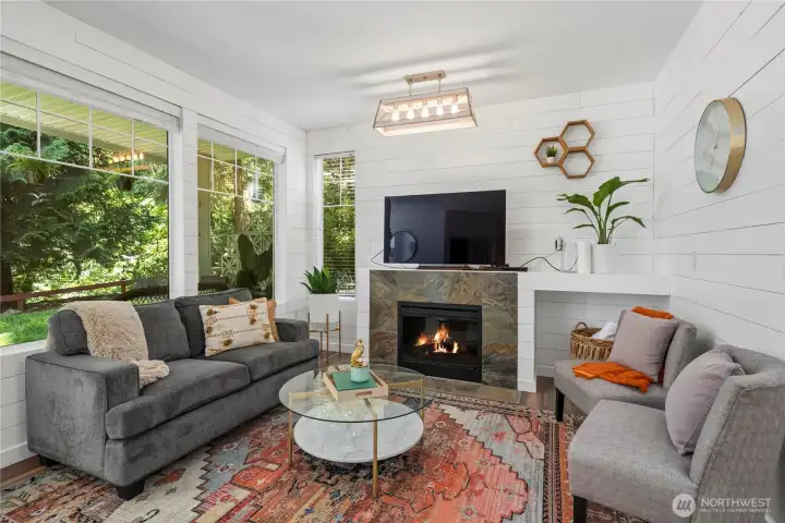 Gas fireplace with windows looking out to greenbelt. Gas fireplace with windows looking out to greenbelt.