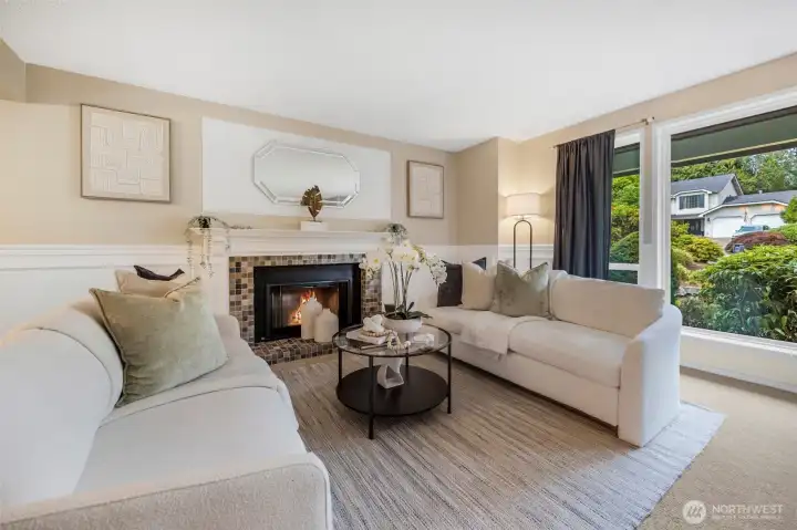 Living room with wood burning fireplace.