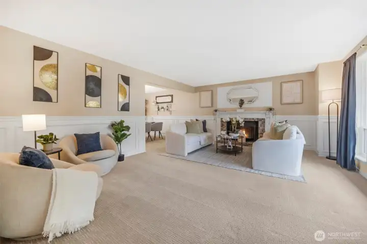 Large living room with wood burning fireplace.