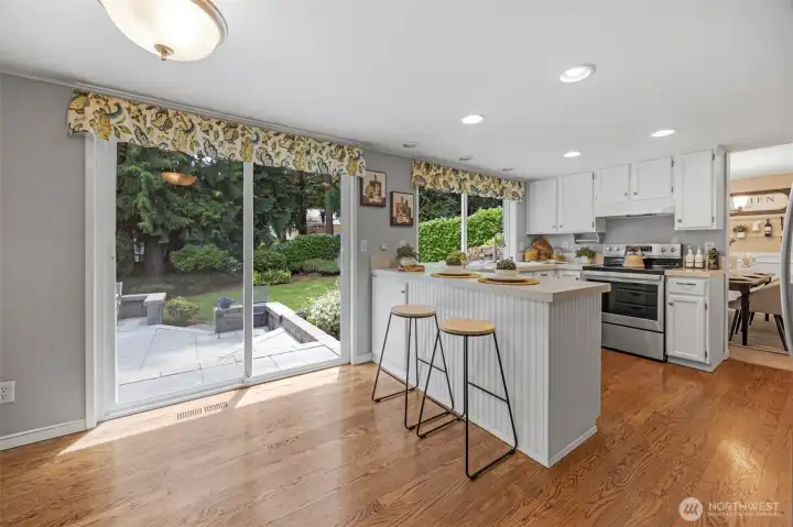 Kitchen with eating space and door to patio.