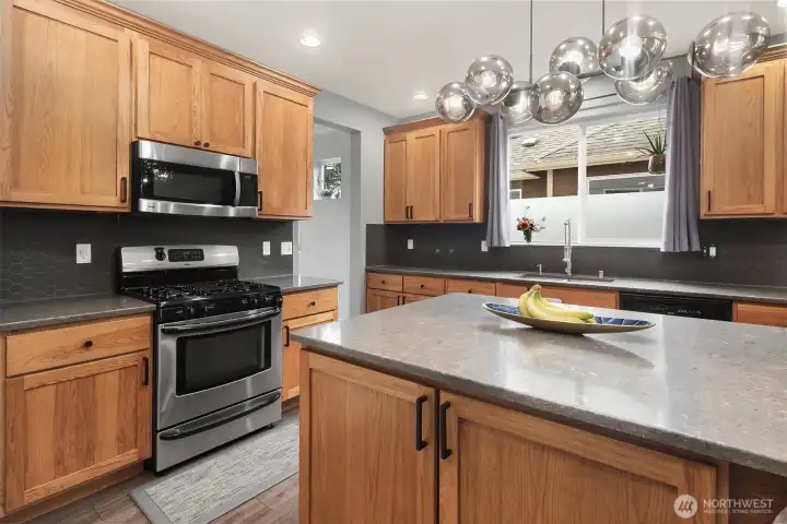 Kitchen comes complete with stainless steel appliances, custom lighting, luxury vinyl flooring, quartz countertops and lots of cabinets for storing everything you may need. Kitchen comes complete with stainless steel appliances, custom lighting, luxury vinyl flooring, quartz countertops and lots of cabinets for storing everything you may need.
