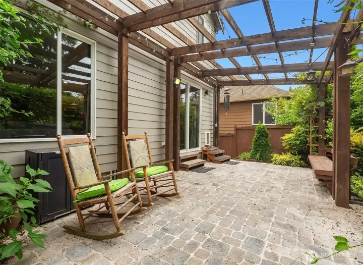 Paver patio and custom pergola sets the scene for outdoor entertaining. Paver patio and custom pergola sets the scene for outdoor entertaining.