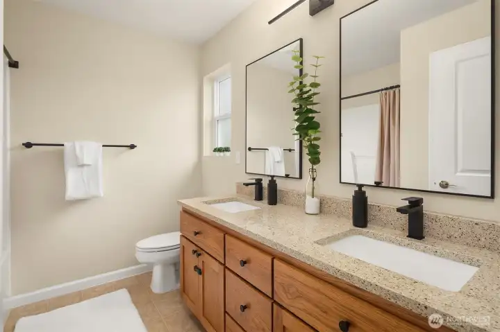 Refreshed bathroom with quartz countertops, mirrors, custom lighting and hardware. Refreshed bathroom with quartz countertops, mirrors, custom lighting and hardware.