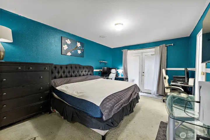 Primary bedroom with french door leading to deck!