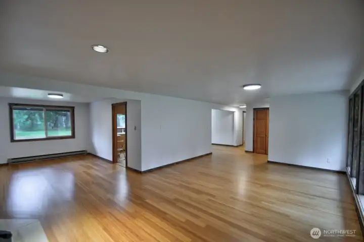 View of living room looking towards the dining room and kitchen
