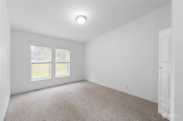 Third guest bedroom overlooks the backyard.