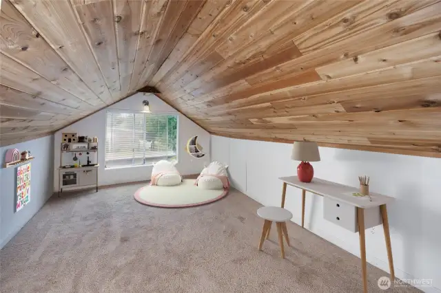 Bonus room/loft area staged as a toy room