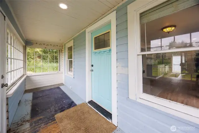 Front door with entrance through sun porch