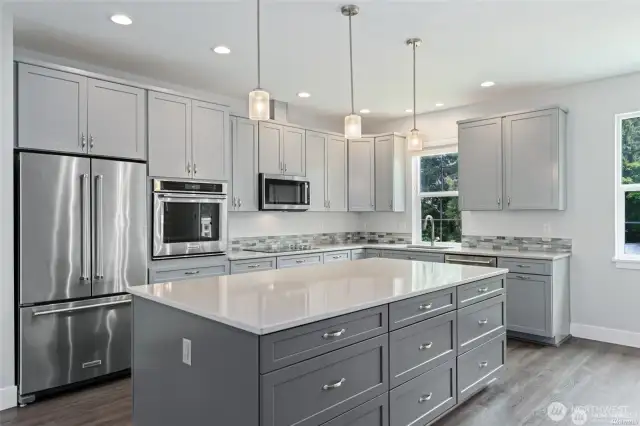 Gorgeous kitchen with lots of lighting.