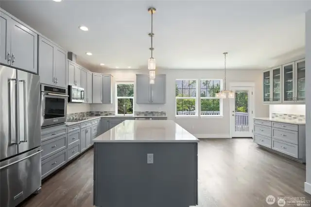 Kitchen has so many cabinets and pull out drawers.