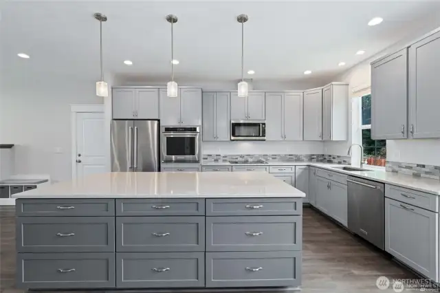 Stylish kitchen with stainless steel appliances.